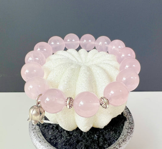 A bracelet made of natural rose quartz and sterling silver accessories
