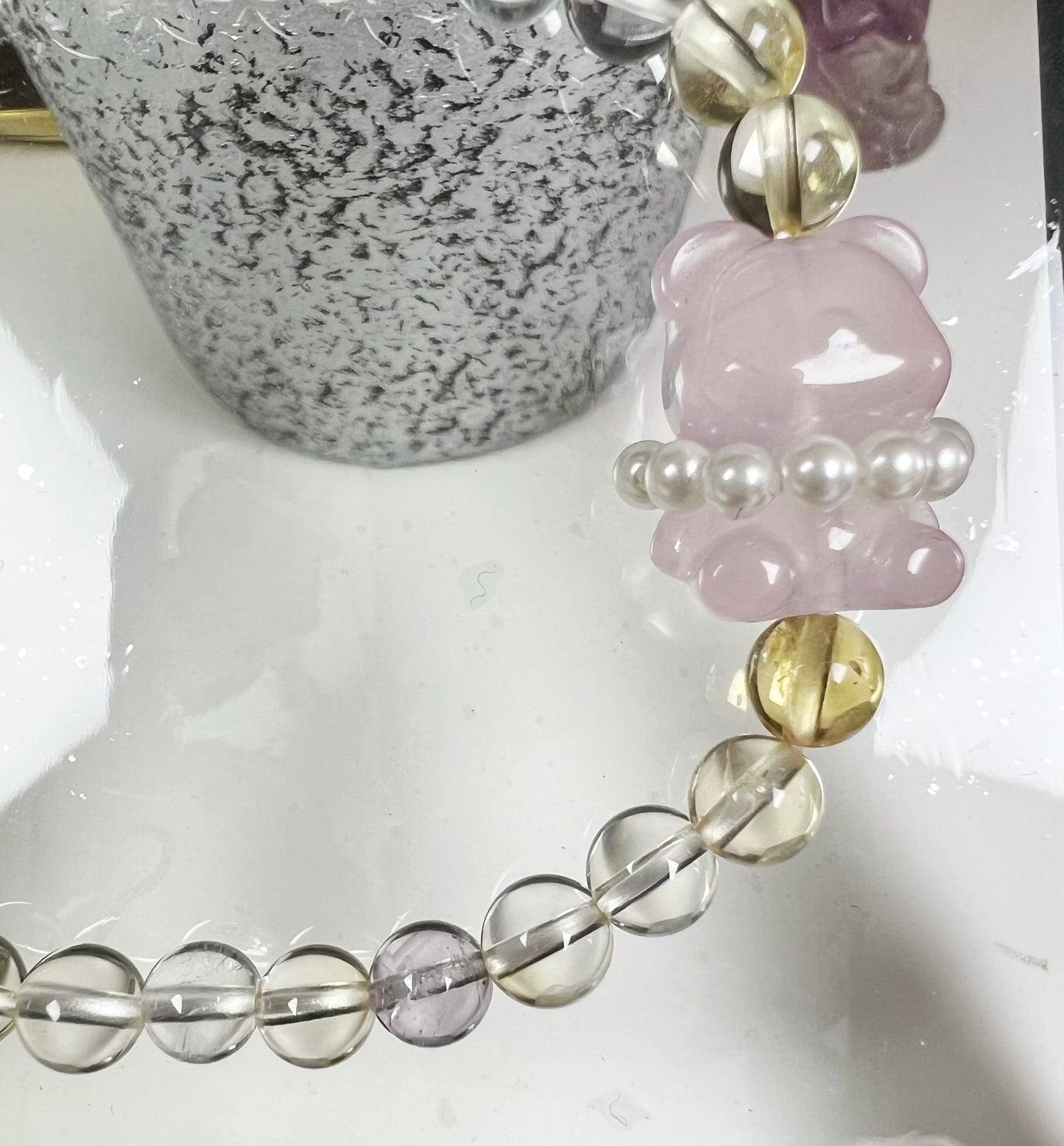 four-season crystal with bear-shaped rose quartz and sterling silver accessories bracelet.